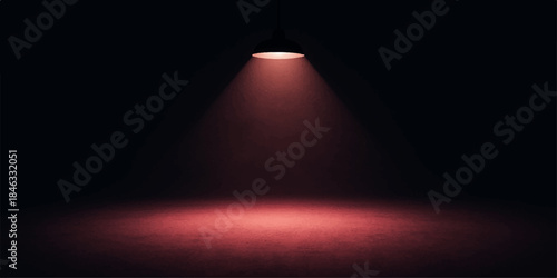 Spotlight shining on stage and wall in dark theater