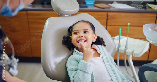 Fotografie Smile, child and consultation with dentist in office for dental checkup, show cavity and extraction