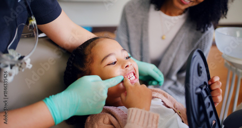 Obraz na płótnie Child, consultation and dentist with mirror in office for dental checkup, show cavity and hygiene