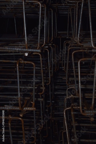 piles of iron being assembled to form the foundation of a building