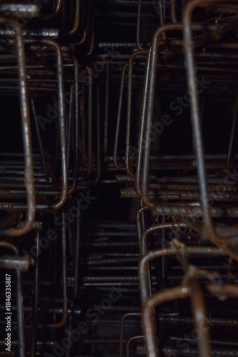 piles of iron being assembled to form the foundation of a building