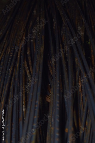 piles of iron being assembled to form the foundation of a building