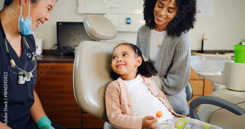 Photos Smile, kid and consultation with dentist in office for dental checkup, tooth extraction and hygiene
