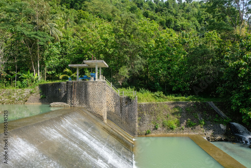 View of a river dam with a small water flow.Ecological and environmental concept. For graphic design, 3D rendering and banners