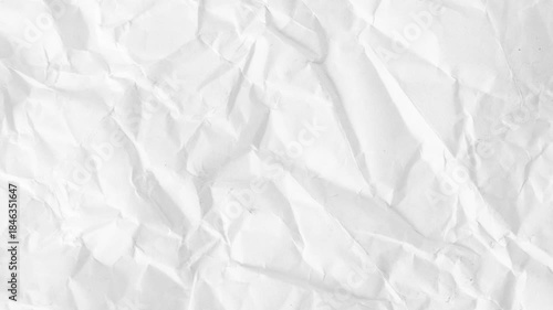 White Crumpled Paper Unfolding Stop Motion Transition.White crumpled paper unfolding animation on black background. Top view of wrinkled sheet opening to reveal texture. Perfect for transitions, intro
