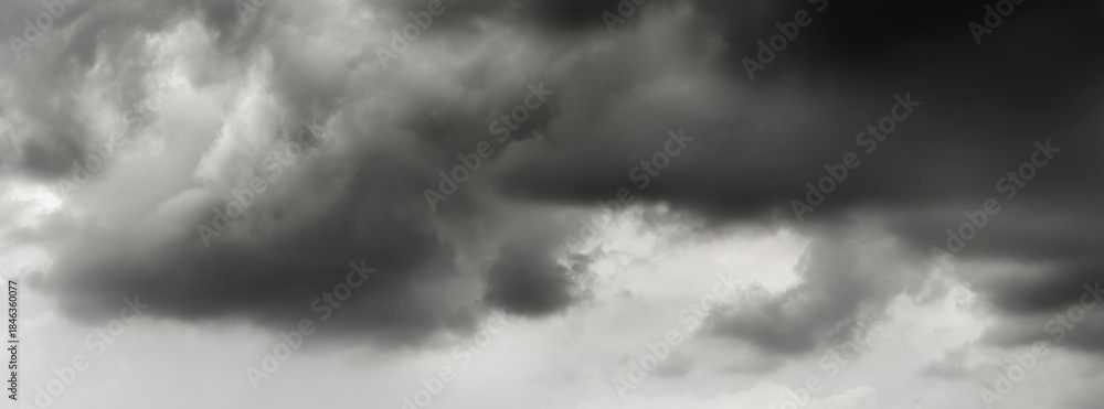Obraz premium dark clouds make sky in black. Heavy rain thunderstorm. Pattern of clouds overcast predict tornado, Hurricane or thunderstorm and rainy. Dark sky cloudy have storm and lightning thunderbolt.