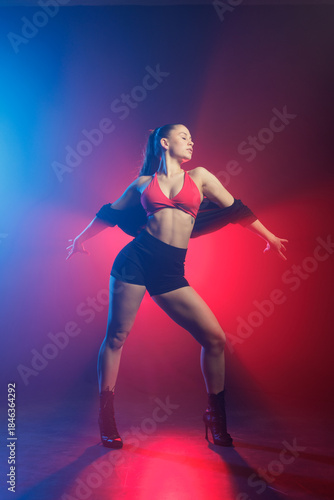 High heels dance choreography in neon smoke studio