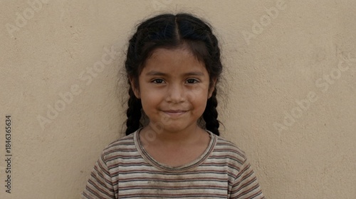 A young girl with braided h...