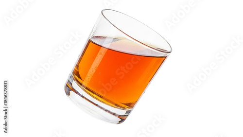 Tilted glass of amber liquid against white background, capturing the essence of a spirited toast or a quiet moment of relaxation, offering simple