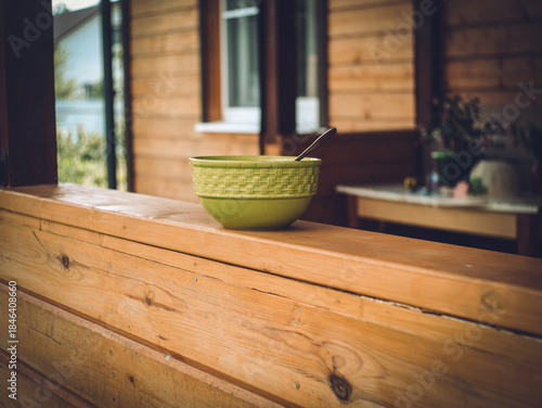 Deep soup bowl on the porch of a rural house