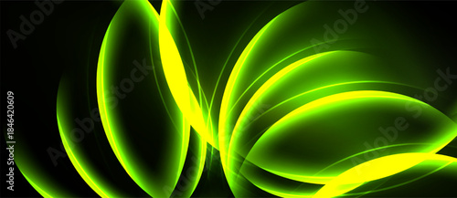 Abstract green light shapes overlap, creating dynamic energy flow. Smooth curves suggest movement, depth within darkness.