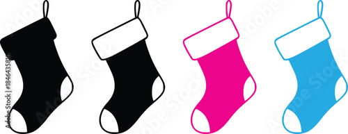 Four colorful christmas stockings hanging isolated on white background