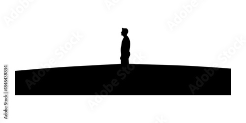 Silhouette of single person standing upright alone.