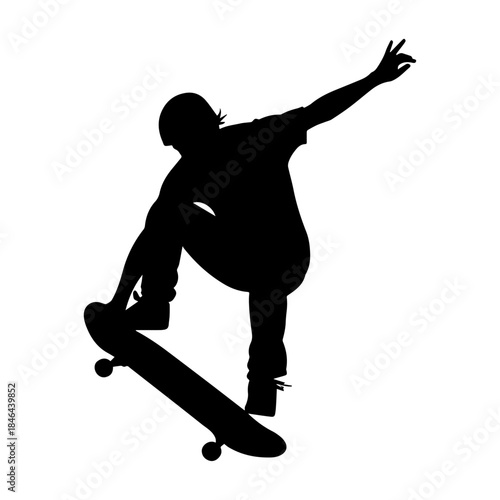 Silhouette of skateboarder performing mid air trick.