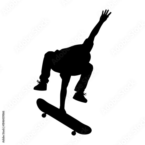 Silhouette of skateboarder performing trick in midair.