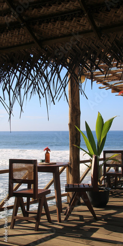 Chairs and table on a beach restaurant terrace in Galle, Sri Lanka.