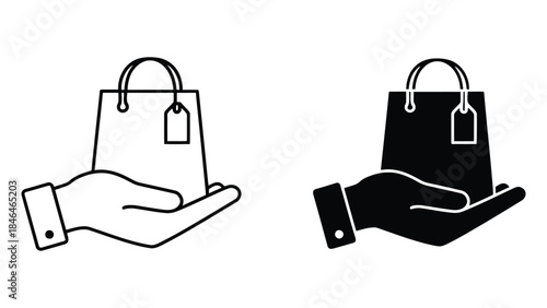 Hands holding shopping bags with tags