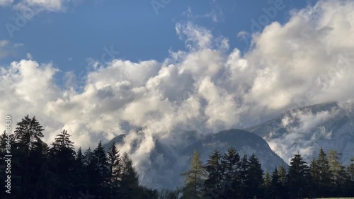 Low Clouds Drifting Over Alpine Mountains