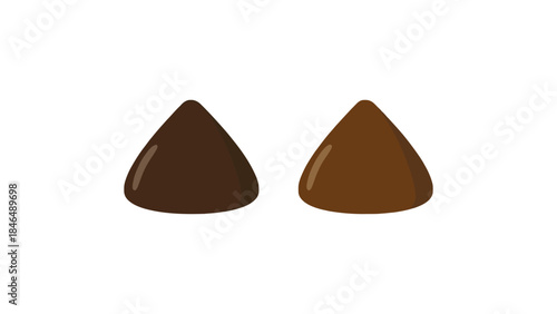 Three chocolate drops in different shades on white