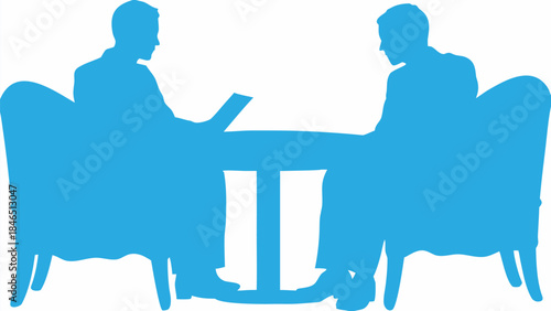 Two business professionals in a meeting with a table and chairs