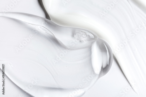 Photos samples of cosmetic care products smear of cream and gel texture on a light back