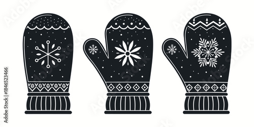 Black winter mittens with snowflake designs on white background