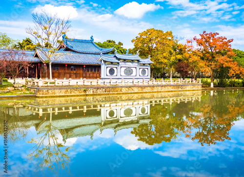 A traditional Chinese pavilion reflected in a lake. Wenzhou, China.