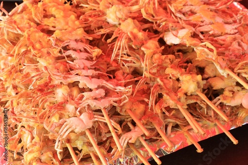 Close-up of Crispy Deep-Fried Mini Crabs on Skewers, Korean Street Food
