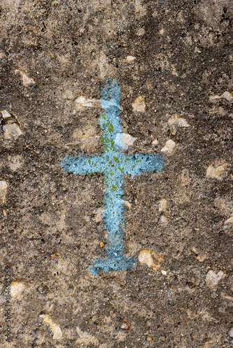 Painted small cross on a wall of a house, Greece