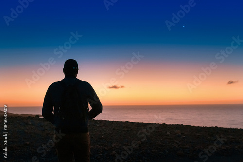Картината върху платно Solitary traveler at sunset reflecting on life journey, freedom and personal tra