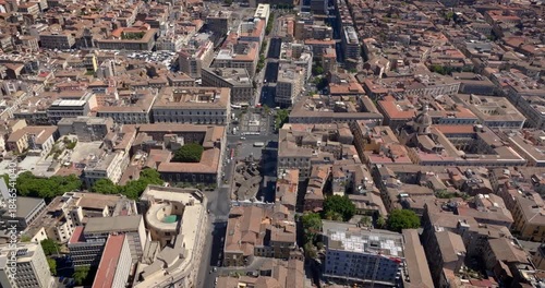 Aerial view of Piazza Stesicoro in the historic center of the city of Catania, Sicily, Italy. It is a rectangular city square in the Sicilian town. It is a sunny summer morning.