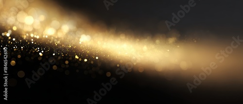 abstract golden light particles floating on dark background, success and achievement concept