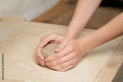 Pottery class. Hands hols clay