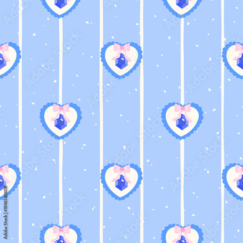 Vector seamless pattern with blue heart-shaped pendants tied with pink bows on a soft blue background. Cute and romantic design perfect for packaging, fabric, and Valentine or wedding-themed decor