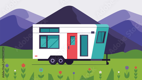 Vibrant camper trailer in serene mountain meadow with colorful flowers