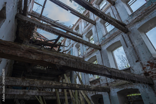 Dilapidated building with a lot of wood and debris