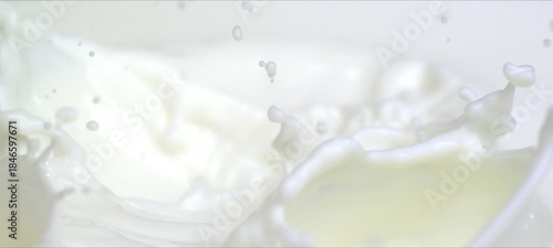 Slow motion almonds falling into milk. Milky splash