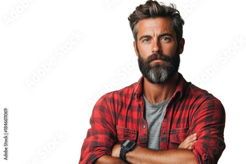 Rugged bearded man with salt and pepper hair wearing a red plaid shirt stands confidently with arms crossed on transparent background
