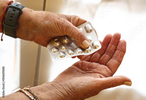 Senior woman is hands holding a blister pack of pills