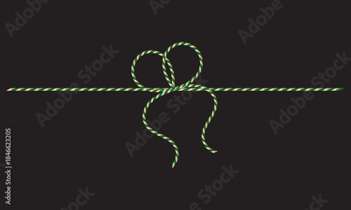 Green and gold String Rope with Crossed Bow Isolated on black background. symbolizing gift wrapping, holidays, celebration, and handmade packaging on black  background.