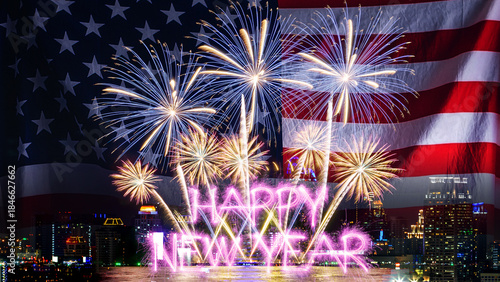 American flag waving with fireworks over city at night. Fireworks display on New Year's Eve to welcome the New Year.