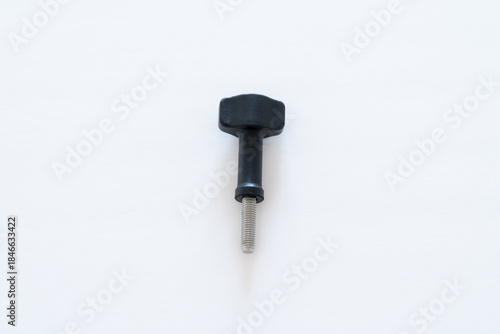 Single Black-head thumb screw vertically placed on white background