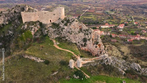 Aerial drone view of Poza de la Sal Castle overlooking the historic village of Poza de la Sal, Burgos, Spain, highlighting medieval heritage, rural tourism, and a scenic cultural landscape. 