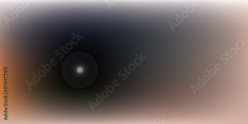 Abstract dark circular light source with bokeh effect.