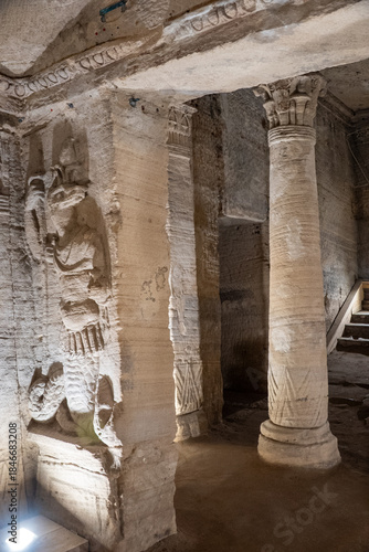 Bas relief carving of a jackal in a toga on the wall of a burial chamber in the Catacombs of Kom el Shoqafa in Alexandria, Egypt