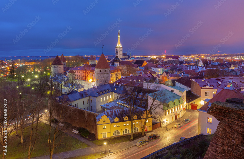 Fototapeta premium Evening view of Tallinn Old Town with medieval towers and St Olaf's Church in Tallinn, Estonia