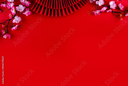 Wallpaper Mural Bright vibrant gold and red Chinese New Year background with mandarin oranges, blossom tree branches, decorative fans, festive greeting envelops and coins, traditional Chinese New Year ornaments Torontodigital.ca