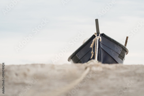 relaxing beach scene with boat by the sea