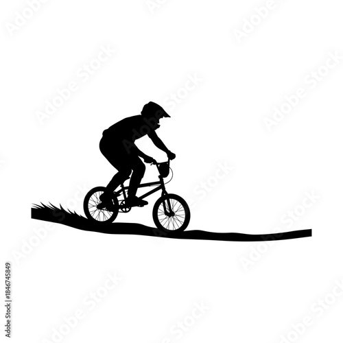 Silhouette of Cyclist Riding Bicycle on Narrow Path.