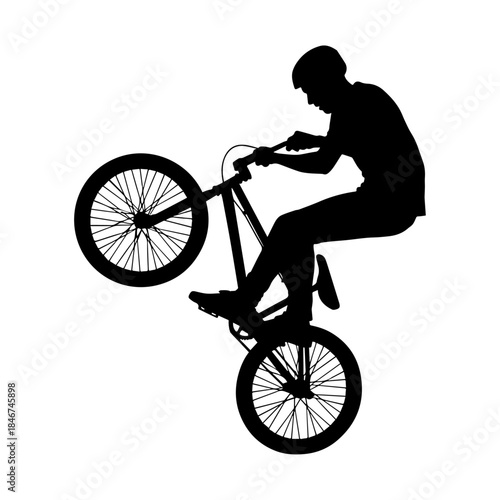 Silhouette of Cyclist Performing Extreme BMX Bike Trick.